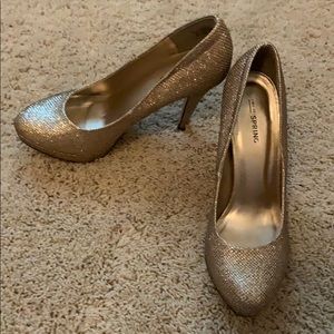Gold, sparkly, high heels.